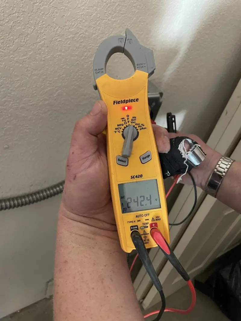 Voltage testing with clamp meter during Outlet Installation in Centerton